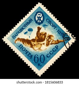 Moscow, Russia - September 15, 2020: Stamp Printed In USSR (Russia) Shows Parachutist In Sky, Free Fall, Series Voluntary Society Of The Assistance To Army, Circa 1959