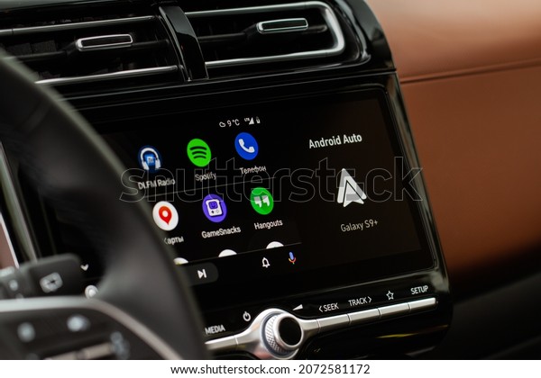 MOSCOW, RUSSIA - SEPTEMBER 15, 2021 Android\
Auto on the screen. Homescreen. Modern car. Interior close up. Car\
media close up view.\
Homescreen.