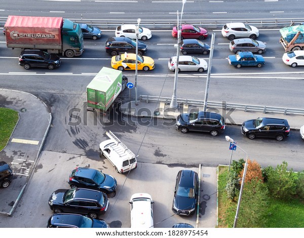 MOSCOW, RUSSIA - SEPTEMBER\
19, 2020: top view of driveway from local parking lot in urban\
courtyard to street in Koptevo District of Moscow city on September\
day