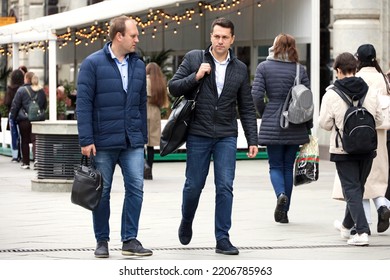 Moscow, Russia - September 2022:  Two Young Men Walking On City Street On People Background