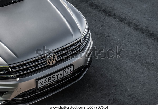 MOSCOW, RUSSIA -\
SEPTEMBER 22, 2017 VOLKSWAGEN TIGUAN front view. Compact crossover\
SUV. Test drive of new car. Volkswagen close up logo. Volkswagen\
car logo bage. VW plate\
logo.
