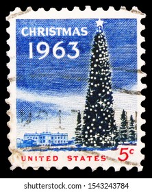 MOSCOW, RUSSIA - SEPTEMBER 24, 2019: Postage Stamp Printed In United States Shows National Christmas Tree And White House, Christmas Serie, Circa 1963