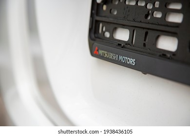 Moscow, Russia: - September 30, 2019: Mitsubishi Motors Logo On License Plate Frame On White Car Close-up, Selective Focus