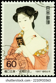 Moscow, Russia - September 30, 2022: Stamp Printed In Japan Shows Painting Woman Applying Powder By Japanese Artist Goyo Hashiguchi (1880-1921), Series Philatelic Week, Circa 1987