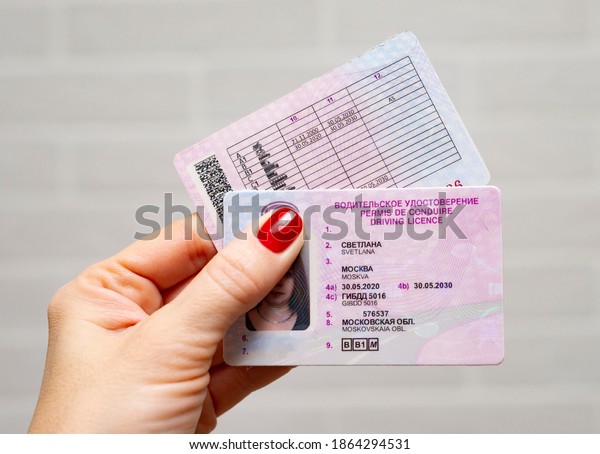 Moscow, Russia-11.30.2020: Russian driver\'s license\
to drive a vehicle, car, motorcycle, bus. Getting or returning a\
driver\'s license for the first time or after being deprived of a\
fine. Female hand.