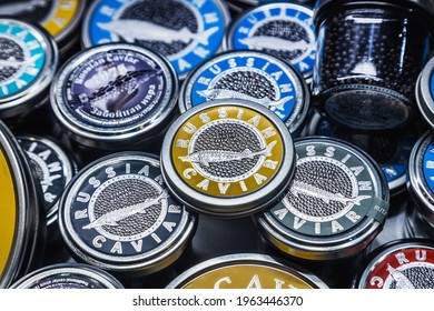 Moscow, Russia-April 12, 2021: caviar of different varieties in tin cans on the counter in a fish store. common name of sturgeon ROE. Traditional black caviar is given by sturgeon, Beluga, sturgeon 