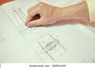 Moscow, Russia-July 27, 2019: Work on a drawing of a diagram by an engineer. Engineers hand over the drawing. - Shutterstock ID 1509916337