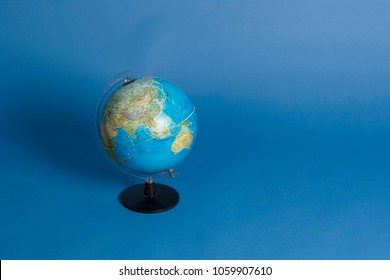 Moscow, Russia-March 15 2018- Global Concept. Blue Globe Against Blue Background In Studio With Empty Place/space For Text-postcard Concept. School Globe -model Of Earth. Object Of Learning. Editorial