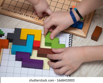 MOSCOW, RUSSIA-March 3, 2020: Katamino is a Board puzzle game. Children play a Board game. Educational games for children. This game was developed by Andre Periolat company