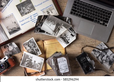 MOSCOW, RUSSIAN - FEBRUARY 20, 2017: Old Family Photos On Wooden Background. Vintage Pictures, Camera, Notepad And Modern Notebook. Flat Lay Close Up View. Presented To Me By My Family.