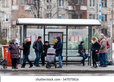 MOSCOW, RUSSIAN FEDERATION - DECEMBER 29, 2016: People wait for a bus at a bus stop.