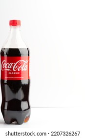 Moscow, Russia-September 16, 2022: One Bottle Of Coca Cola On A White Background. Vertical Snapshot