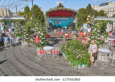 MOSCOW, SEP. 06, 2018: View On Beautiful Flower Beds, Small Music Stage, People On Benches On Street Festival Flower Jam On Red Square. People On City Holidays Celebration