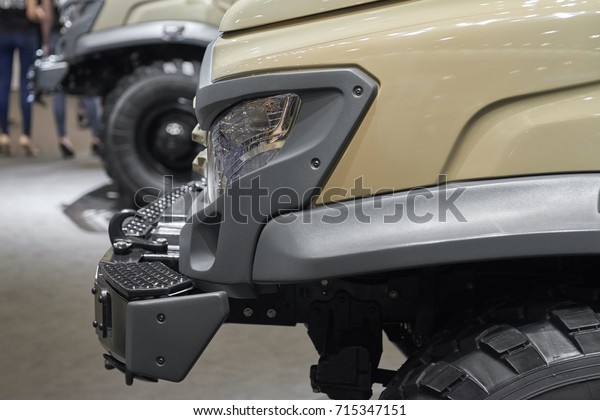 MOSCOW, SEP, 5, 2017: Close up view on russian off\
road car GAZ for for hard to reach areas and hunting. Car lights.\
Commercial Transport Exhibition ComTrans-2017. Off-road car close\
up. Military jeep