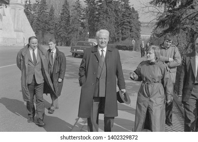 Moscow, USSR - March 28, 1991: Chairman Of The Presidium Of The Supreme Soviet Of The Russian SFSR Boris Nikolayevich Yeltsin Walks Outdoors In Kremlin With His Bodyguards And Associates.