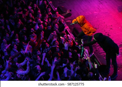 MOSCOW-16 FEBRUARY,2017: Famous Canadian Rapper Jazz Cartier Performing In Crowded Night Club.Rap Singer On Stage In Front Of Concert Audience In The Club.View From Top.Music Fans Wave Hands To Singer