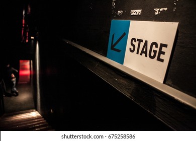 MOSCOW-2 JUNE,2016:Sign arrow shows way to stage in night club.Big concert hall backstage staircase for singer to enter the main scene.Way to the main stage on concert