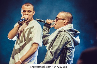 MOSCOW-2 OCTOBER,2014: Big Concert Of Famous Russian Hip Hop Band Centr In Nightclub.Young White Rap Singer Sings In Microphone On Stage.Rapper Guf Singing In Radio Mic On Scene In The Club