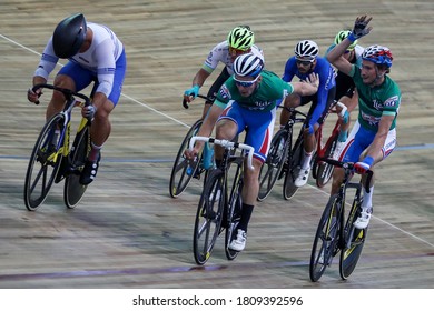 Moscow-2020, August: Cycling Track Race UCI Grand Prix Moscow, September 2020, Velodrome Krylatskoe, Russia. Cyclists Of Russia Team Keep In Touch During Madison Cycling Race Zoom Panning Effect