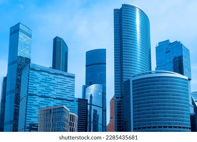 Moscow-city. Cities of Russia. Bottom view of skyscrapers in center of Russian capital. Business center of Moscow. Office rental in Moscow. Office real estate. High-rise buildings against blue sky - Powered by Shutterstock