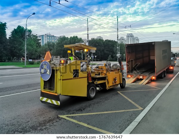 Moscow/Russia - 07/01/2020: Road\
marking machine on a wide avenue of the city. Urban road\
safety.