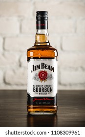 MOSCOW/RUSSIA - APRIL 24, 2018: Jim Beam bourbon bottle on wooden table. Jim Beam is a famo?s brand of whiskey and the highest selling American bourbon in the world.