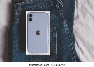 Moscow/Russia - January 12, 2020: Packaging Of Iphone 11 On Denim Pants In Bed Closeup. Top View. 