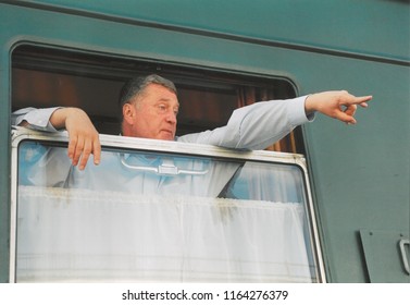 Moscow,Russia - July 12, 2004. The Party Leader Of LDPR Vladimir Zhirinovsky Waving From The Window Of The Car