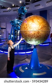 MOSCOW,RUSSIA - November 4, 2016: Little Girl Looking At The Exhibits Of The Moscow Planetarium