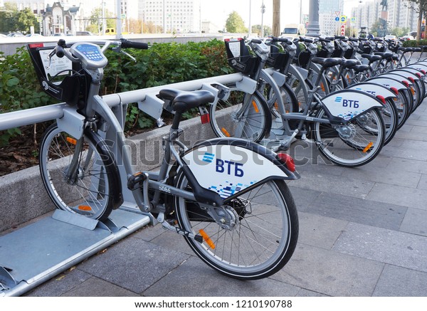     Moscow/Russia - October 2, 2018: Bicycle rental in\
the center of Moscow. Moscow car sharing. City bikes for rent  at\
automatic rental station in Moscow. People use Credit Card of Smart\
Card.      