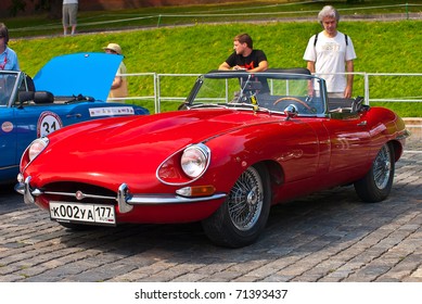 MOSCOW,RUSSIA-JULY 10: Red Jaguar E-Type year 1963 is on display at the start annual Rally of classical cars "Zolotoe kol'co" on Red Square with more than 30 crews, on July 10, 2010 in Moscow, Russia