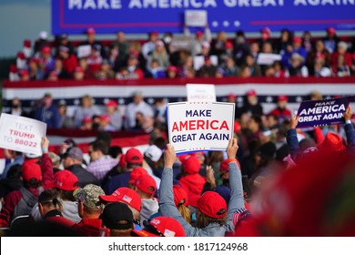 Mosinee, Wisconsin / USA - September 17th, 2020: Donald trump supporters holding up signs make america great again, pro life, cops for trump, peaceful protester, and 4 more years at president rally. 