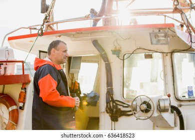 Moskenes, Lofoten Islands, Norway - October 2016: A Fisherman On A Fishing Boat.