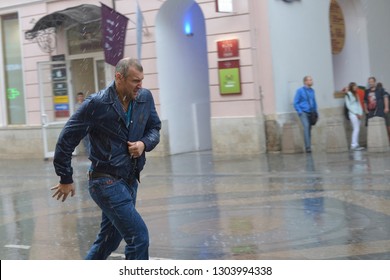 Moskow, Russia - August 22, 2018: A Man Runs In Heavy Rain Without An Umbrella