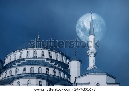 Mosque and full moon in the sky. Background image for Ramadan and Eid al-Adha greetings