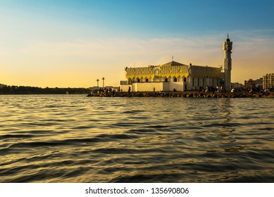 Mosque In Jeddah Beach At Sunset & People Around It