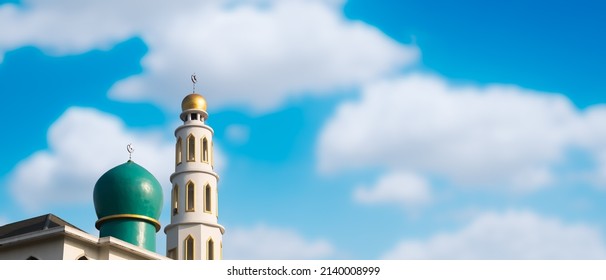 Mosques Dome buiding on blue sky background. ramadan islamic religion symbols. Islamic new year Muharram, Mubarak, Eid al-fitr, Eid al-Adha, arabic concept. portrait with free space. - Shutterstock ID 2140008999