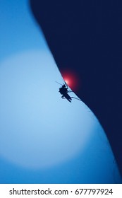 Mosquito Bites A Human Skin At Night, Blurred Moon Background