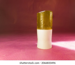 A Mosquito Repellent Gel Stick On A Magenta Paper Background