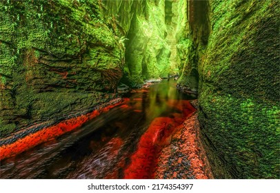 In a moss covered cave. Cave in water. Mossy cave in water. Mossy cave pass