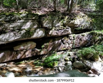 Mossy Rock Wall Beside A River