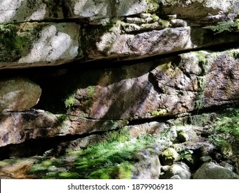 Mossy Rock Wall Beside A River