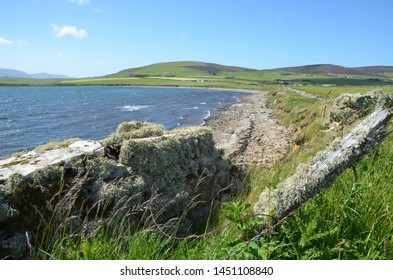 Mossy Wall And Loch On Scapa Flow In Orkney