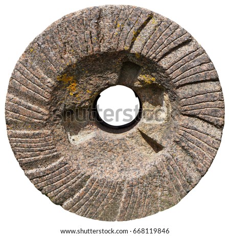 The most ancient granite mill round millstone for a grain crunching in flour. Isolated on white vintage  outdoor object