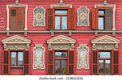 The most beautiful facade in Rotovz Town Hall Square in Maribor. Six windows with wooden shutters. The wall decorated by paintings. Maribor, Slovenia.  - Shutterstock ID 1538022656