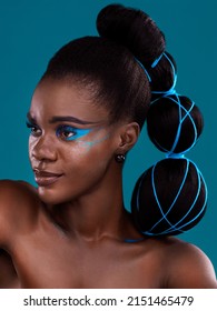 The Most Beautiful Face There Ever Was. Studio Shot Of A Beautiful Young Woman Posing Against A Turquoise Background.