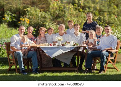 Most beautiful happy family in garden, portrait of three generations, outdoor