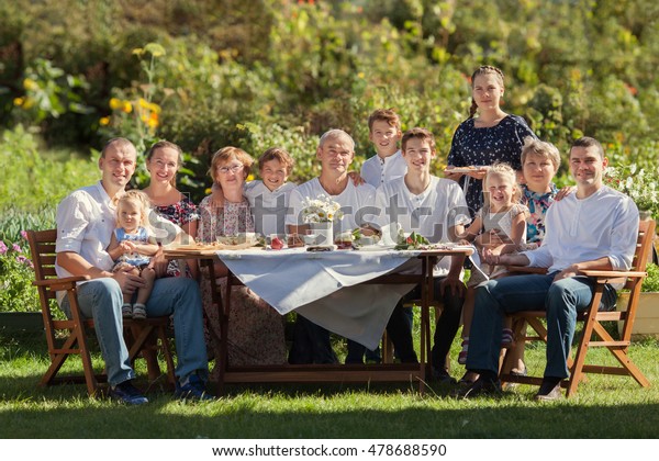 Most beautiful happy family in garden, portrait\
of three generations,\
outdoor