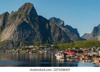 The most famous fishing village Reine on Lofoten islands, Nordland, Norway. Amazing nature with dramatic mountains and peaks, open sea and bays of Lofoten islands.