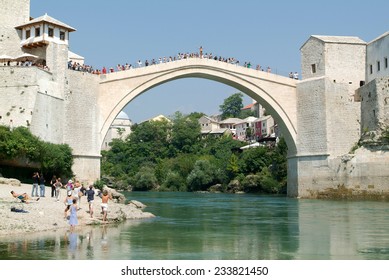 Mostar, Bosnia Herzegovina - 2 September 2004: Tourists Watching At People Who Jump From The Famous Bridge Of Mostar